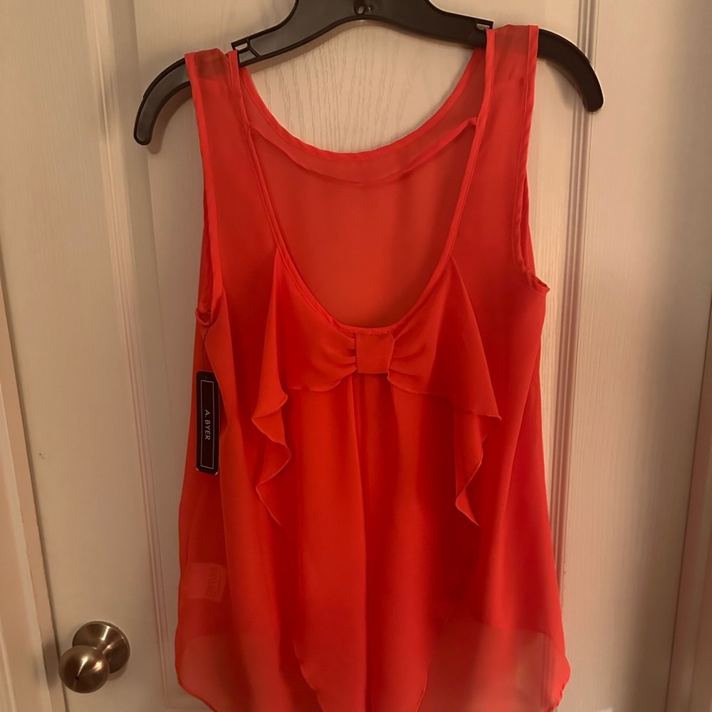 Sleeveless blouse deep orange in color size Medium 
New With Tags